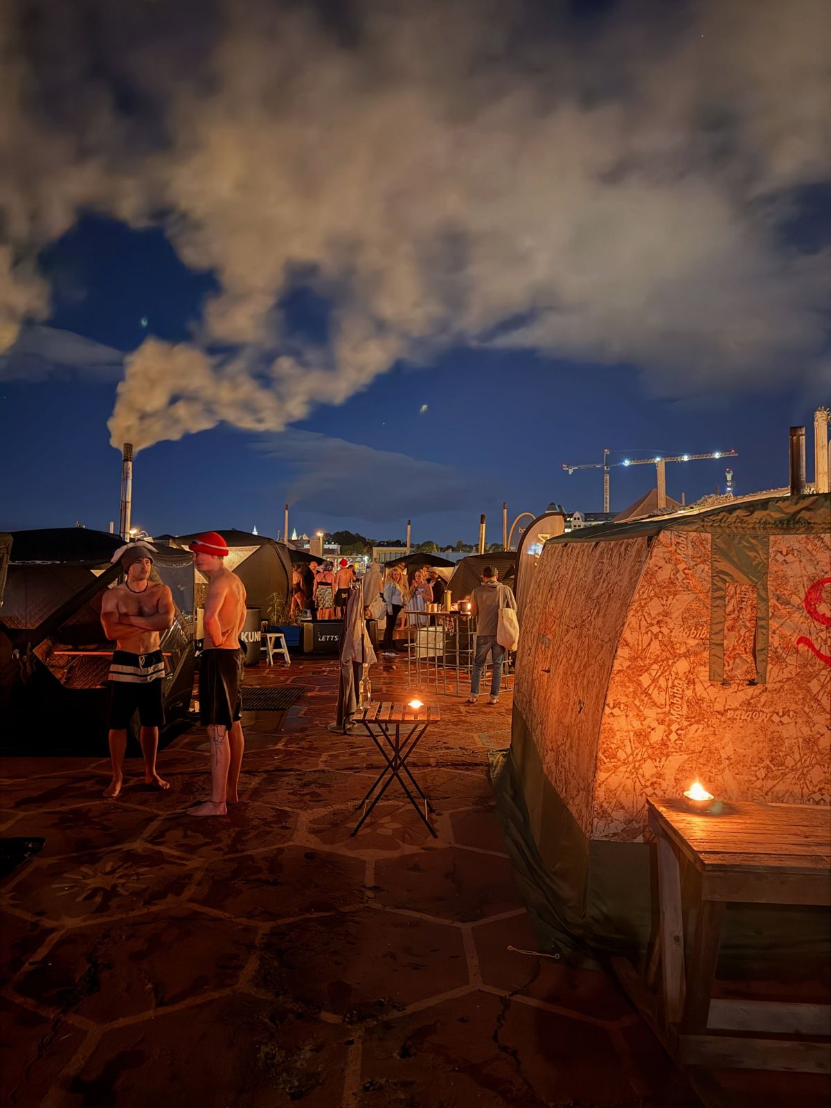 Steam rising from a harbourside sauna at night in Oslo